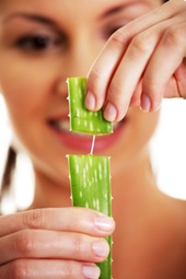 woman using aloe vera to get rid of stretch marks