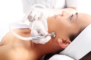 woman having facial microdermabrasion