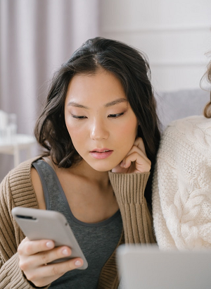 woman looking at her cell phone