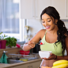 woman eating healthy food that is good for her skin