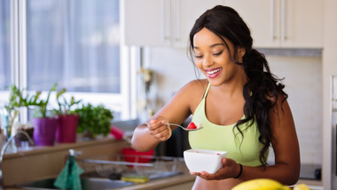 woman eating healthy food that is good for her skin